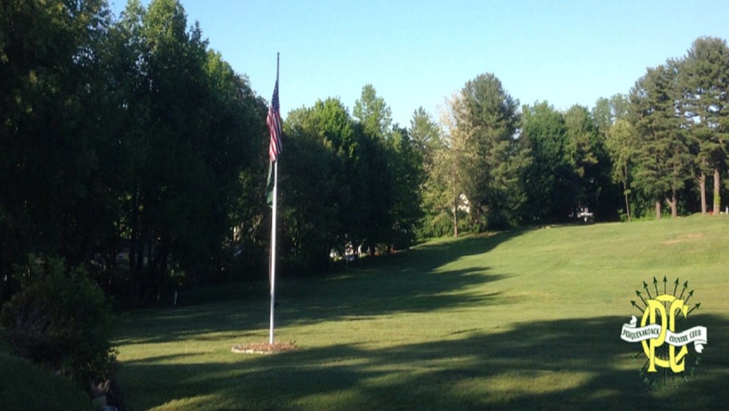 An American flag stands on the Pehquenakonck Country Club golf course
